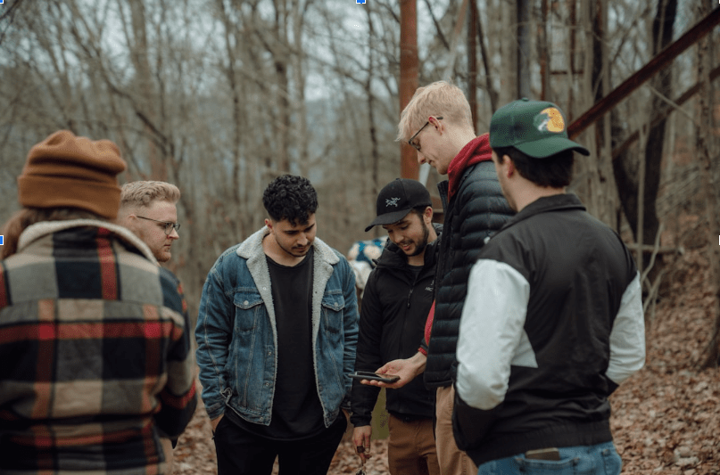Group of people discussing strategies for enhancing donor communication through SMS